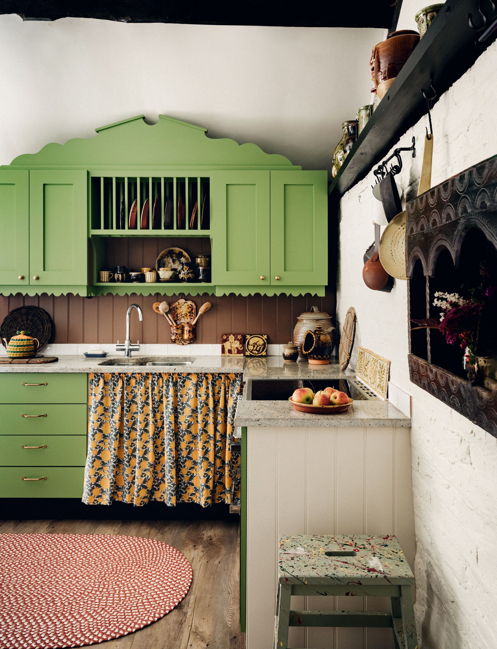 ‘Invisible Green by Edward Bulmer in the kitchen of Phoebe Clive's 16thcentury Herefordshire cottage.