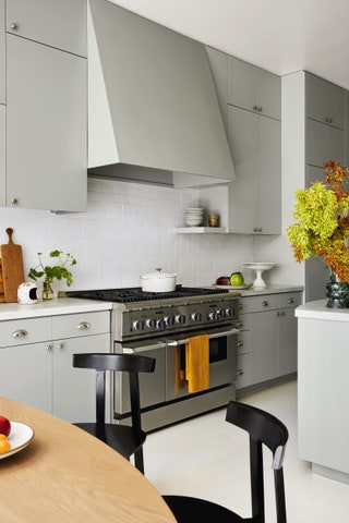 The kitchen also features a Benjamin Moore neutral this time with units painted in ‘Marina Gray  a foggy grey that is...