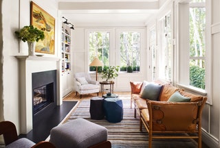 In the family room of this house in San Francisco panelling painted in Benjamin Moores ‘White Dove  provides the perfect...