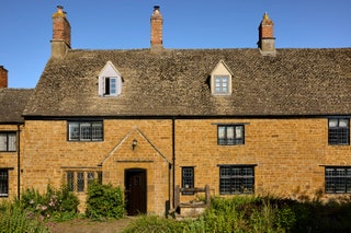 Image may contain Architecture Building Housing House Manor Row House and Lamp