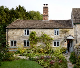 Image may contain Cottage Housing House Building Roof Grass and Plant