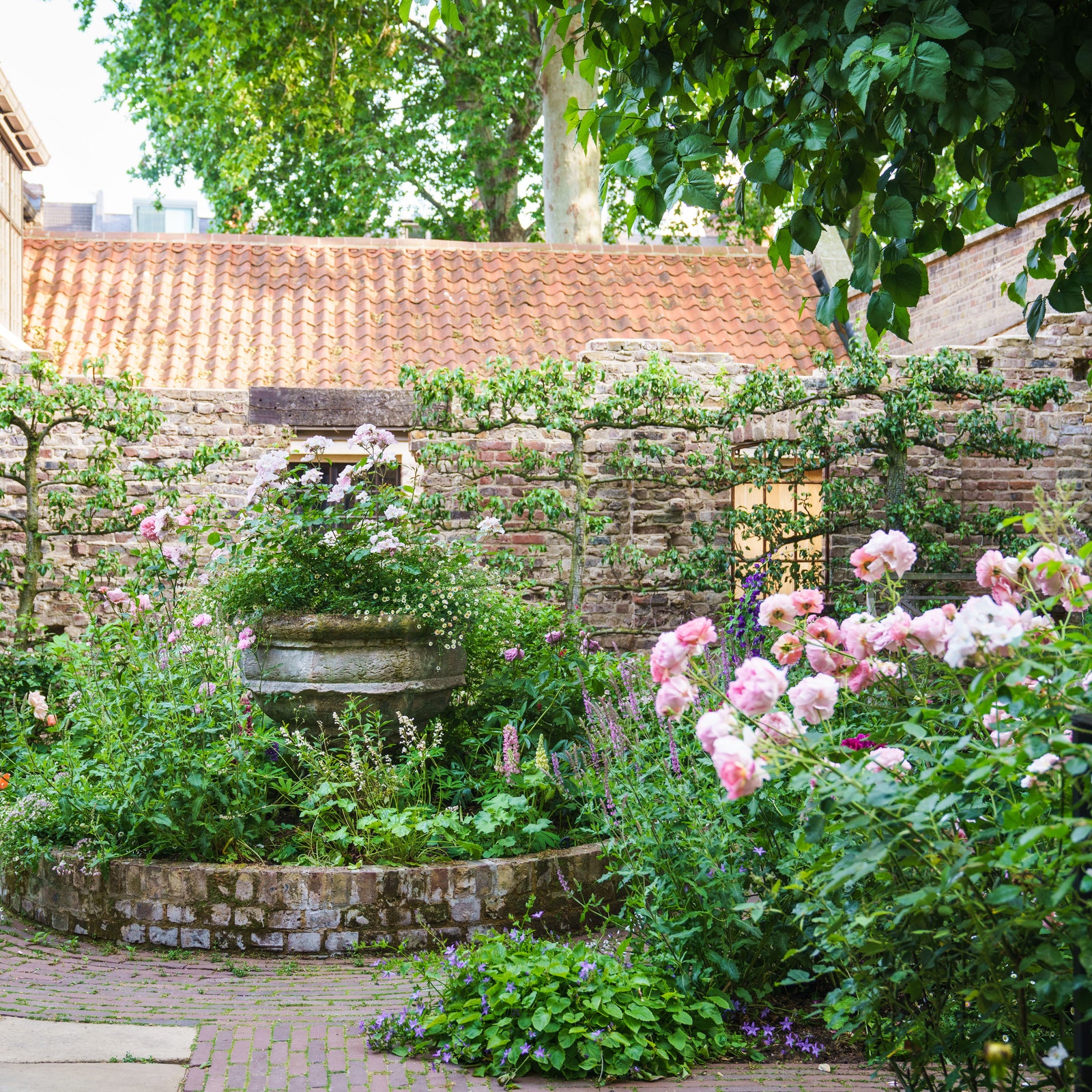 A romantic, rose-filled walled garden hidden away in the busy heart of Spitalfields